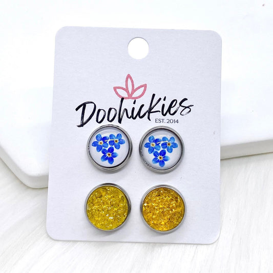 12mm Blue Flowers & Sunshine Sparkles in Stainless Steel Settings -Earrings by Doohickies Wholesale