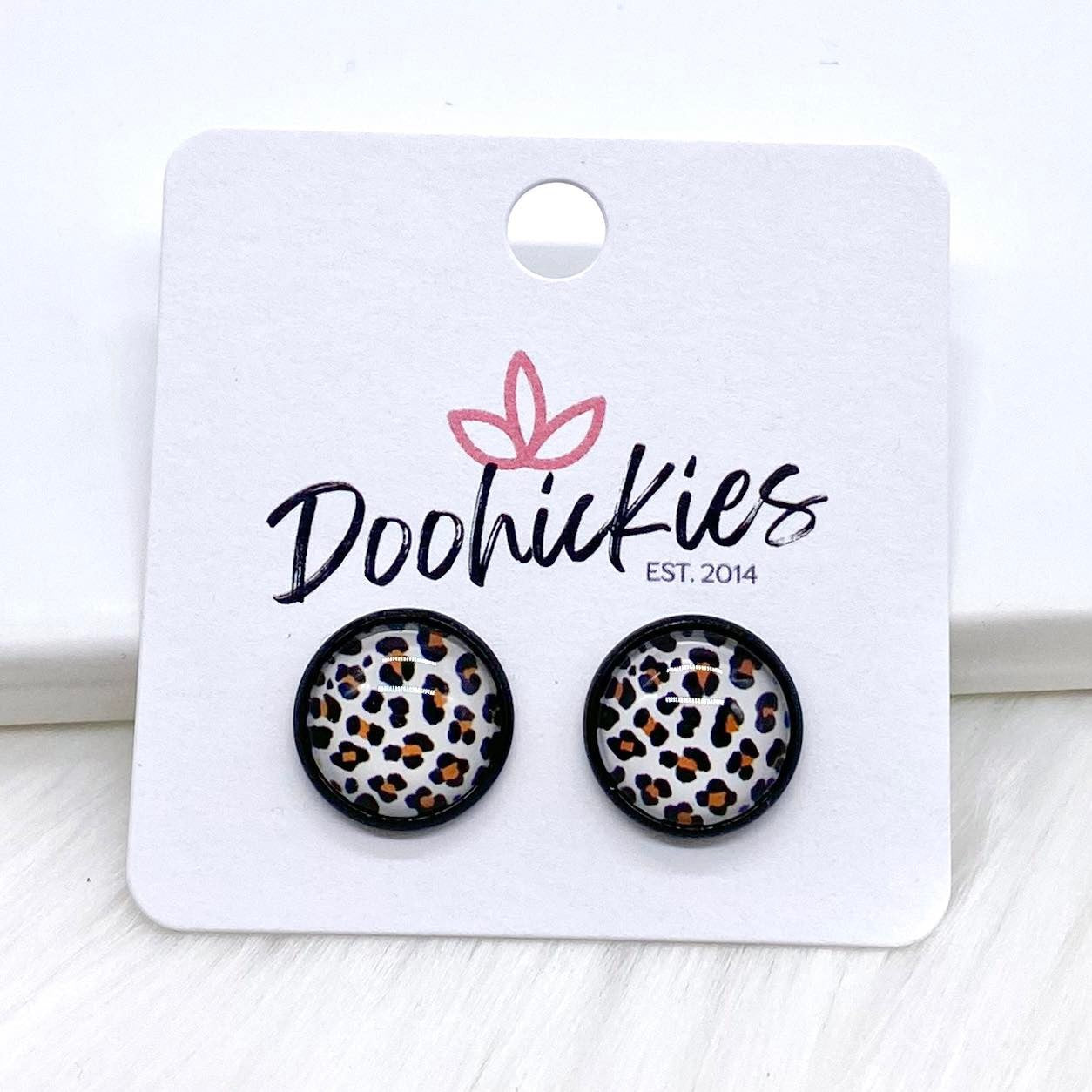 12mm Jungle Cat Singles in Black Settings -Earrings by Doohickies Wholesale