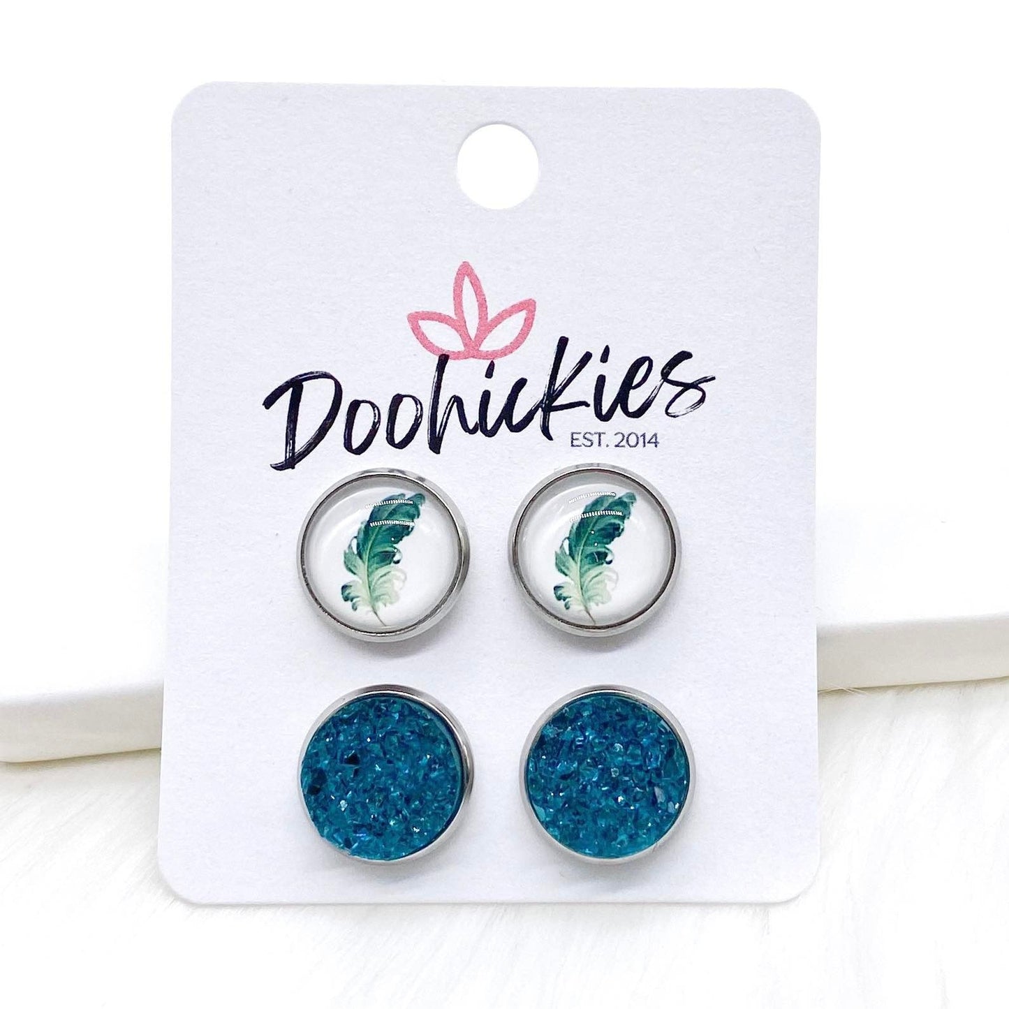 12mm Teal Feathers & Teal Sparkles in Stainless Steel Settings -Earrings by Doohickies Wholesale