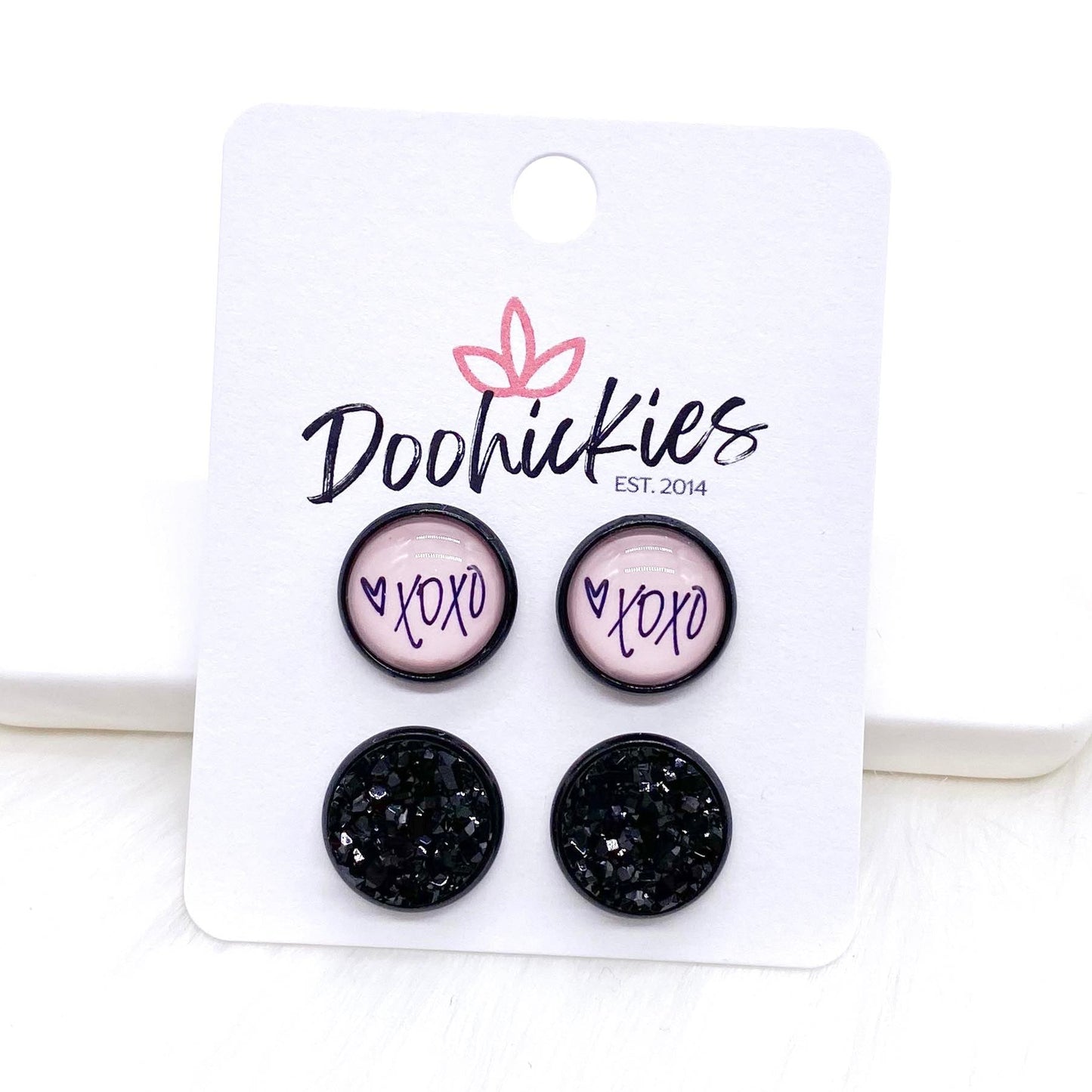 12mm Valentine Pink XOXO & Black in Black Settings -Earrings by Doohickies Wholesale