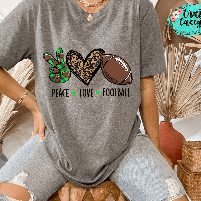 Green Peace Love Leopard Football Women's-Unisex  T-shirt. by Crafty Casey's