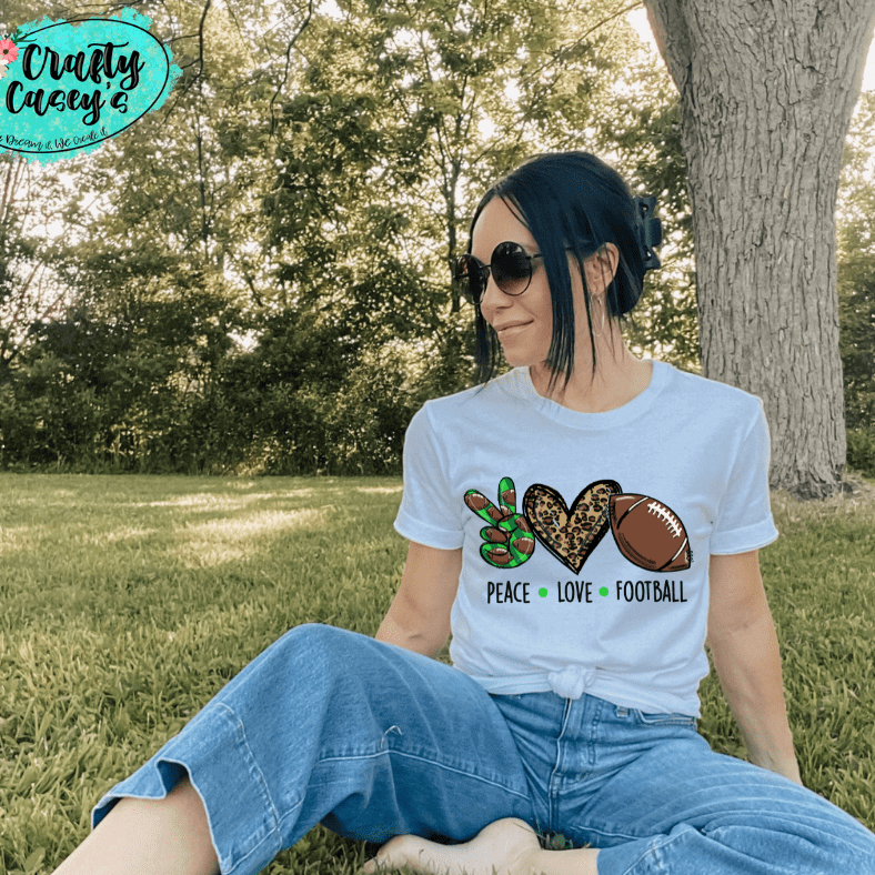 Green Peace Love Leopard Football Women's-Unisex  T-shirt. by Crafty Casey's