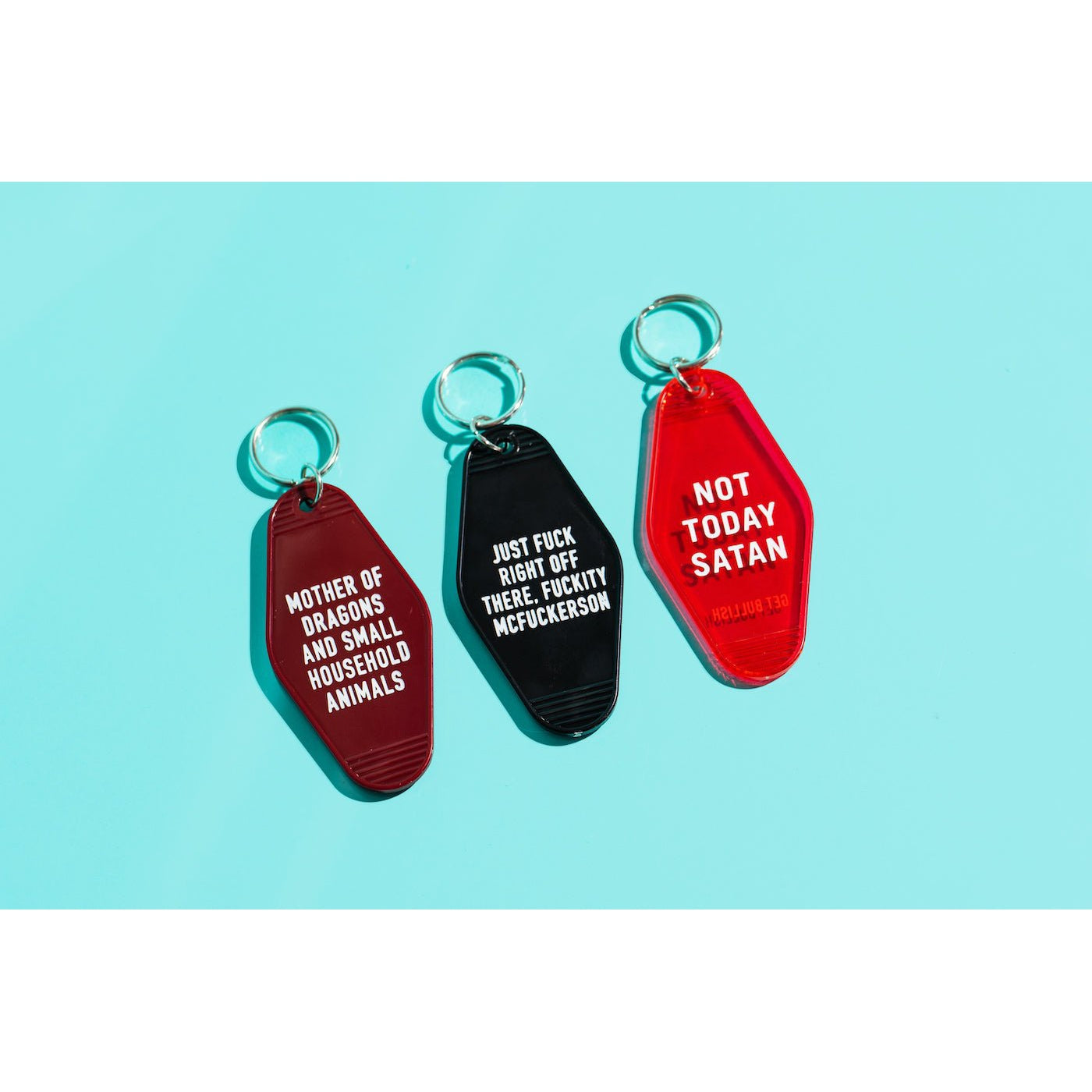 Mother of Dragons and Small Household Animals Motel Style Keychain in Dark Red by The Bullish Store