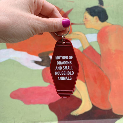 Mother of Dragons and Small Household Animals Motel Style Keychain in Dark Red by The Bullish Store