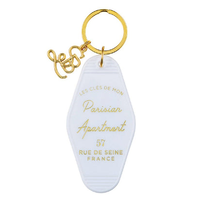 Parisian Apartment Motel Keychain in White by The Bullish Store