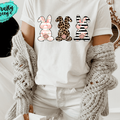 Pastel Bunny Trio-Easter -  T-shirt. by Crafty Casey's