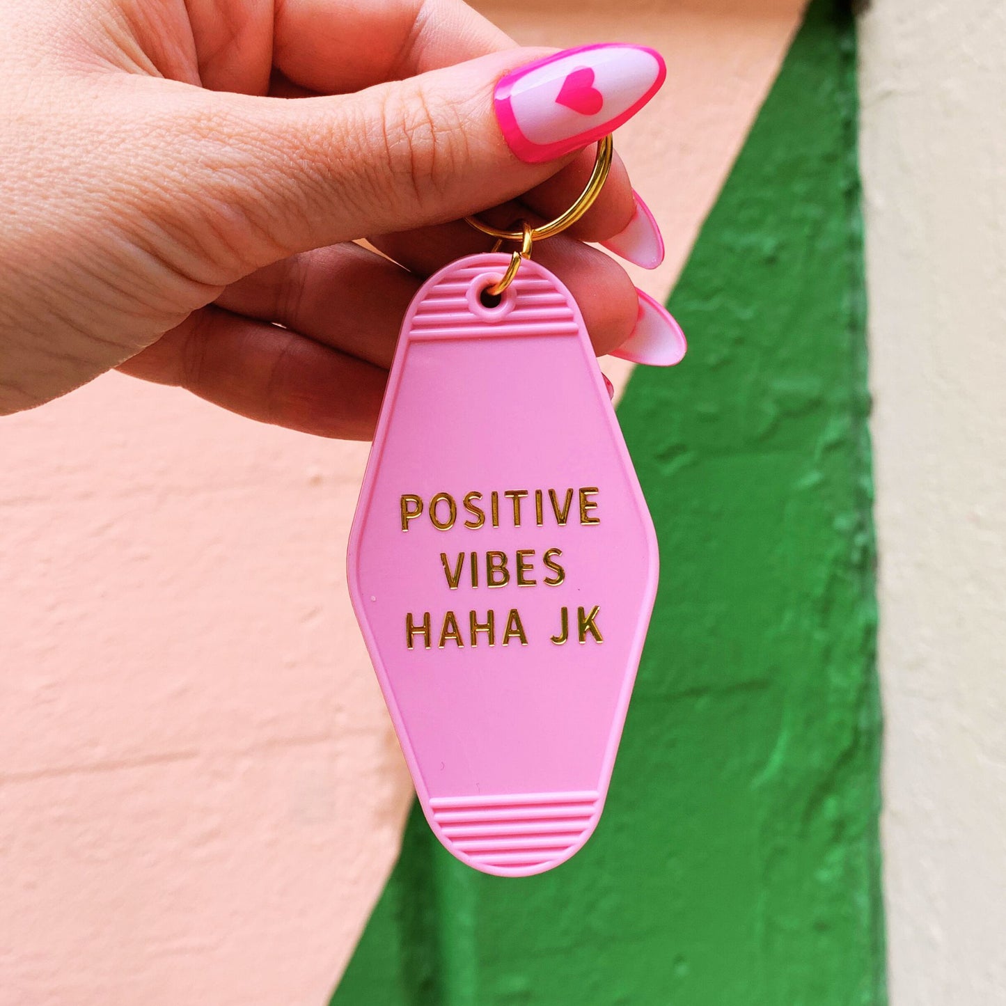 Positive Vibes Haha JK Motel Keychain in Pink by The Bullish Store