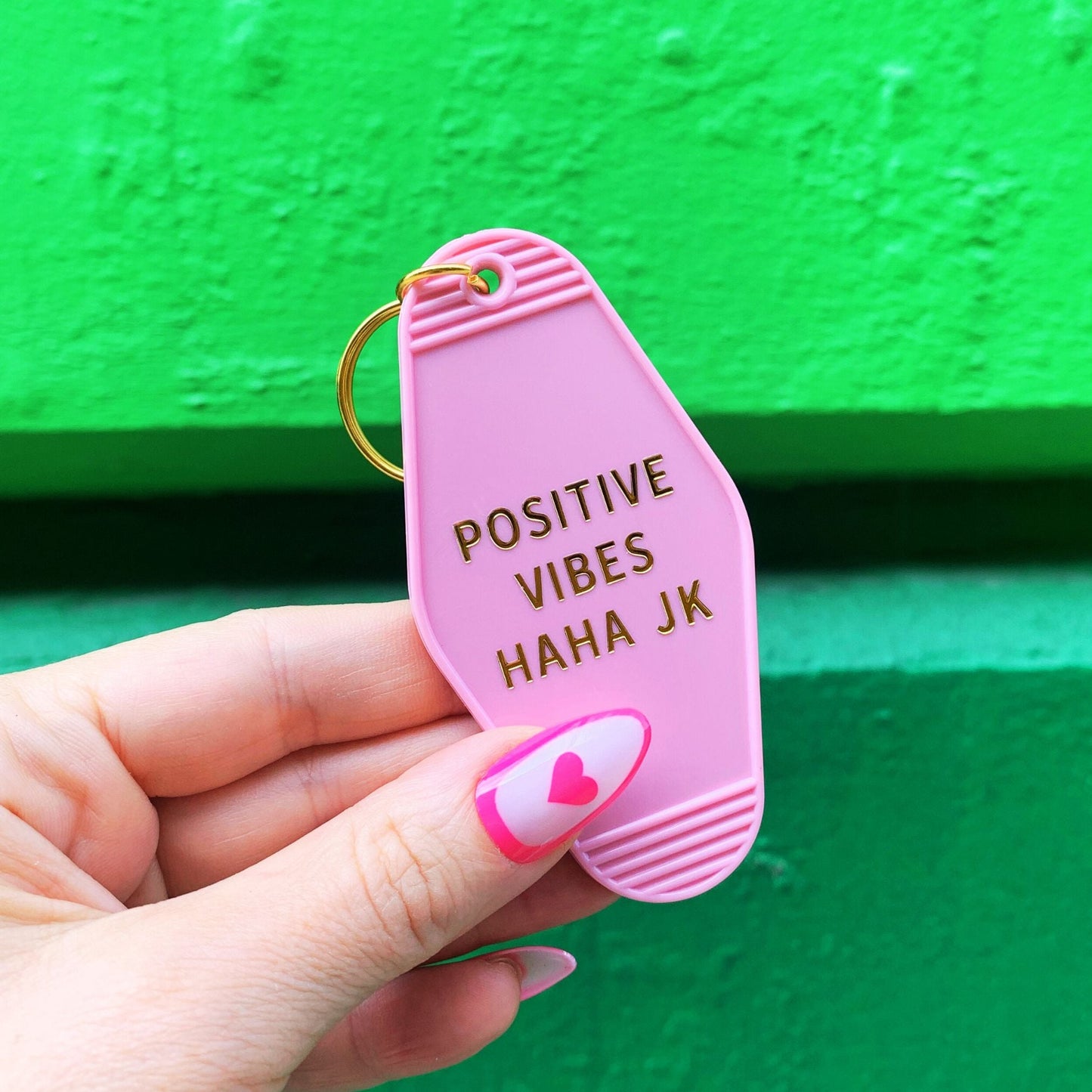 Positive Vibes Haha JK Motel Keychain in Pink by The Bullish Store