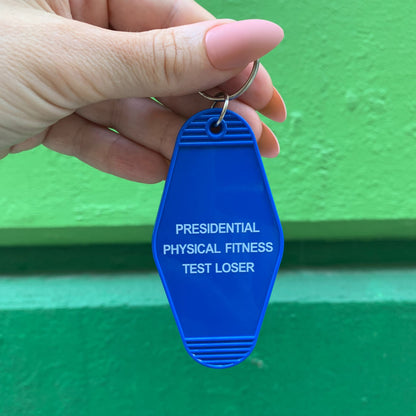 Presidential Physical Fitness Test Loser Motel Style Keychain in Blue by The Bullish Store