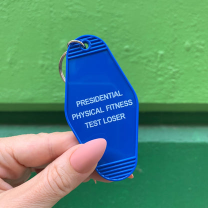 Presidential Physical Fitness Test Loser Motel Style Keychain in Blue by The Bullish Store