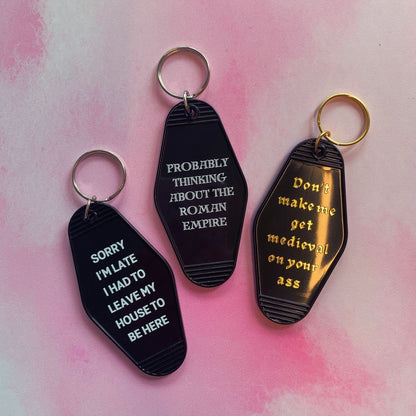 Probably Thinking About the Roman Empire Motel Style Keychain in Black by The Bullish Store