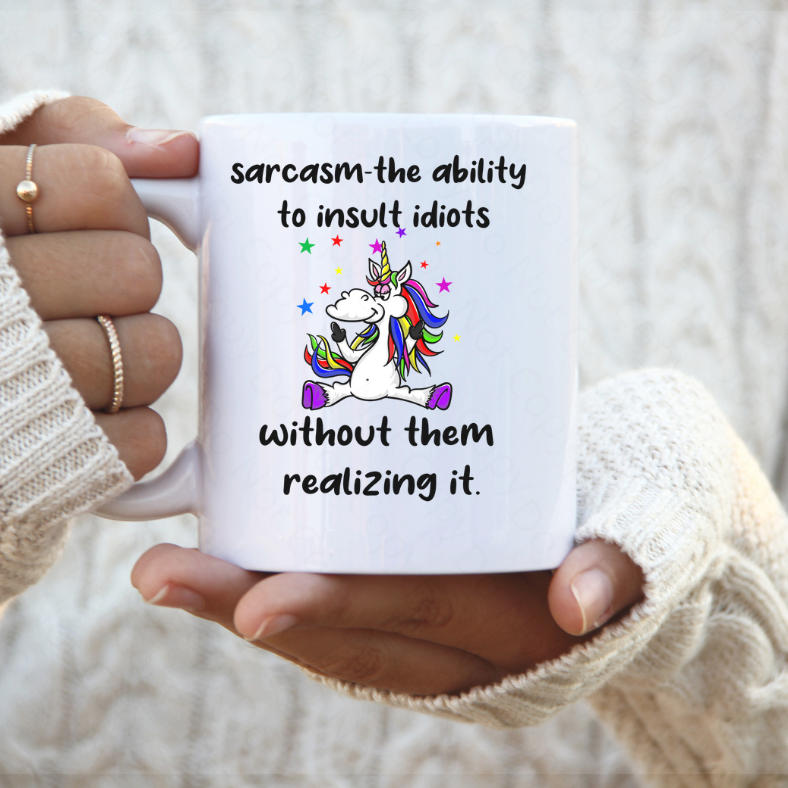 Sarcasm Is The Ability To Insult Idoits Unicorn Coffee Mug by Crafty Casey's