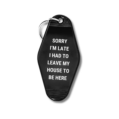 Sorry I’m Late I Had to Leave My House Motel Style Keychain in Black by The Bullish Store