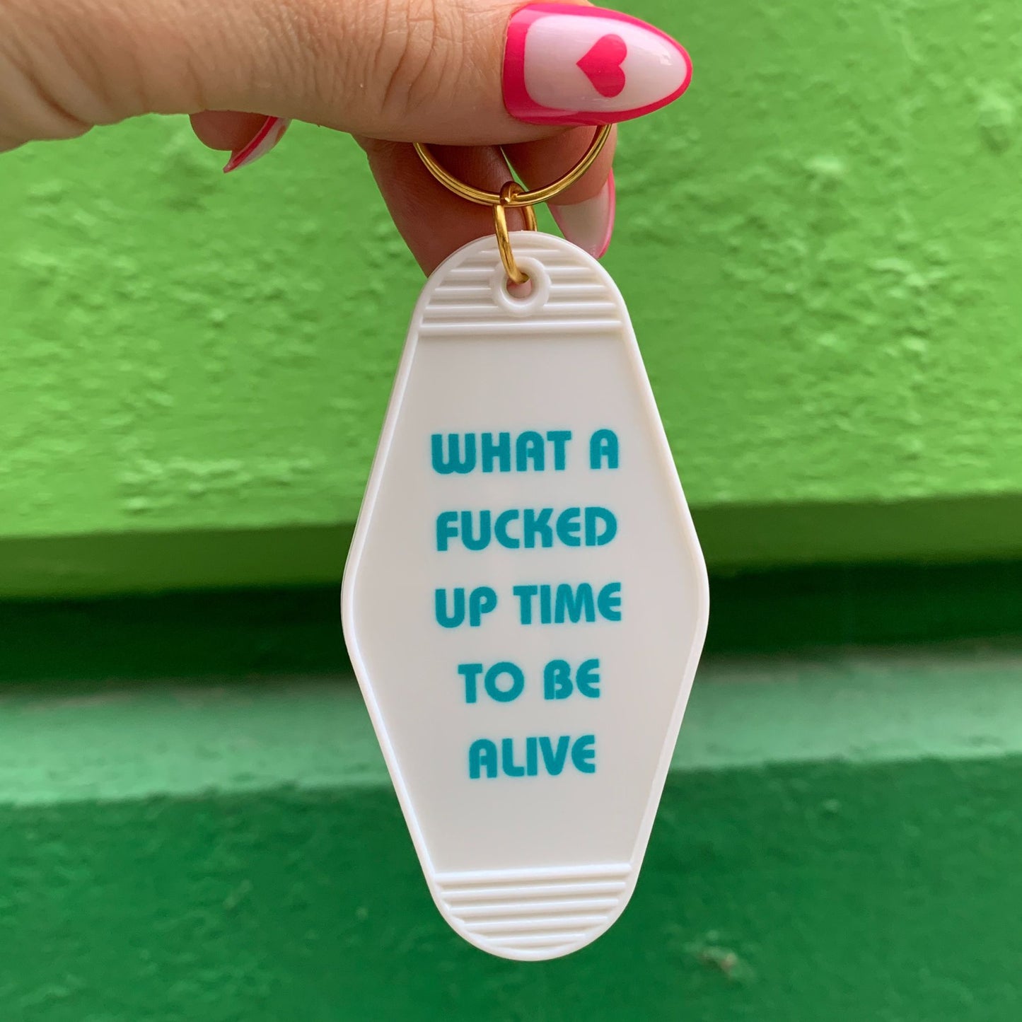 What a Fucked Up Time to Be Alive Motel Style Keychain in White by The Bullish Store