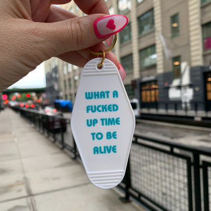 What a Fucked Up Time to Be Alive Motel Style Keychain in White by The Bullish Store