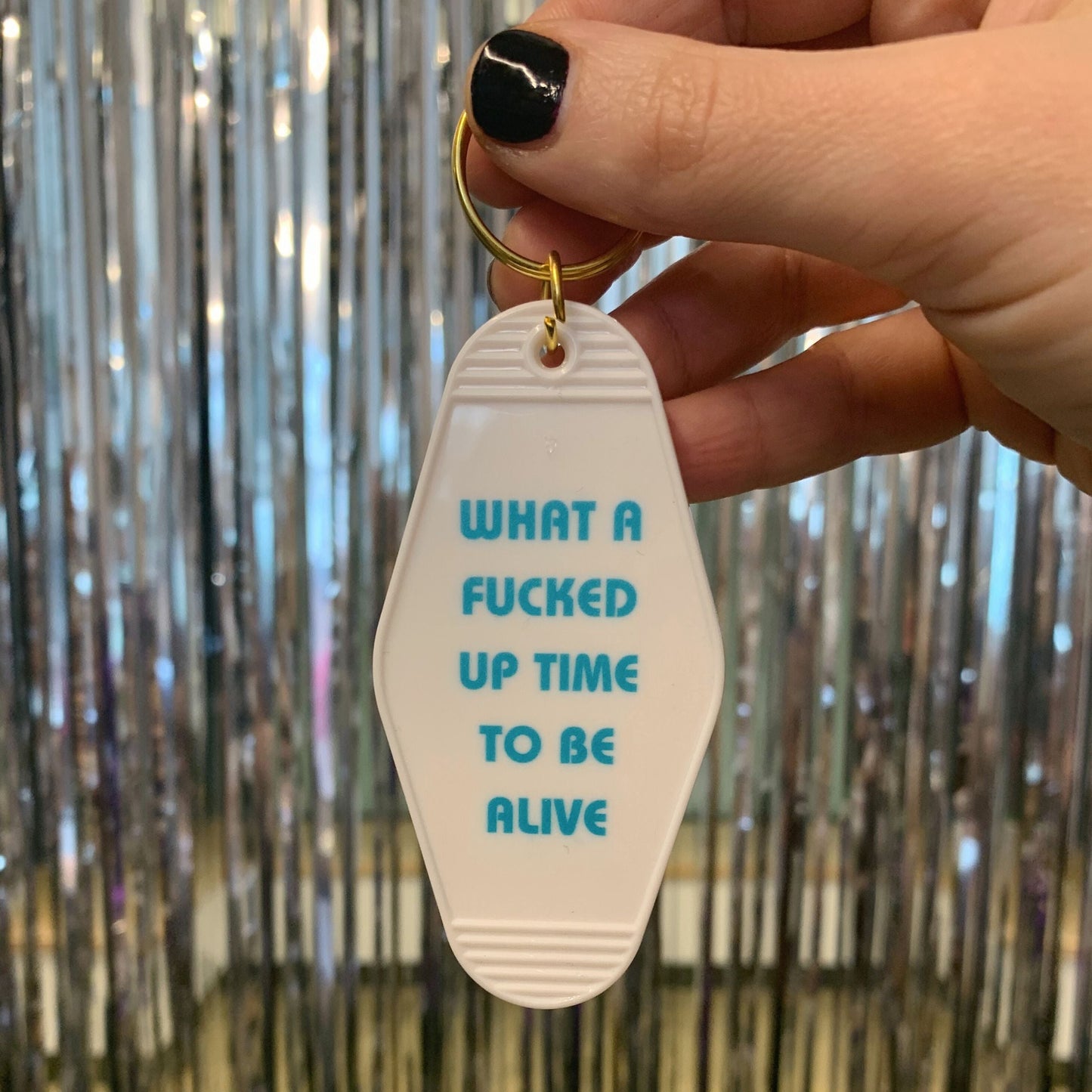 What a Fucked Up Time to Be Alive Motel Style Keychain in White by The Bullish Store