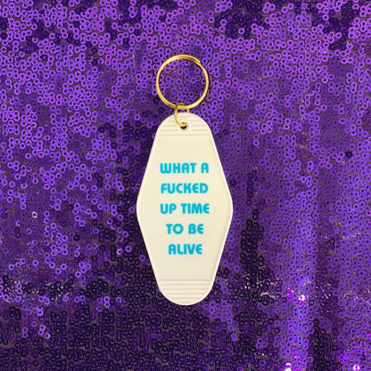 What a Fucked Up Time to Be Alive Motel Style Keychain in White by The Bullish Store