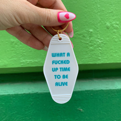 What a Fucked Up Time to Be Alive Motel Style Keychain in White by The Bullish Store