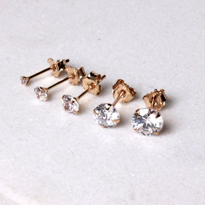 Pair of 14Kt Yellow Gold Clear Round CZ Stud Earrings by Fashion Hut Jewelry