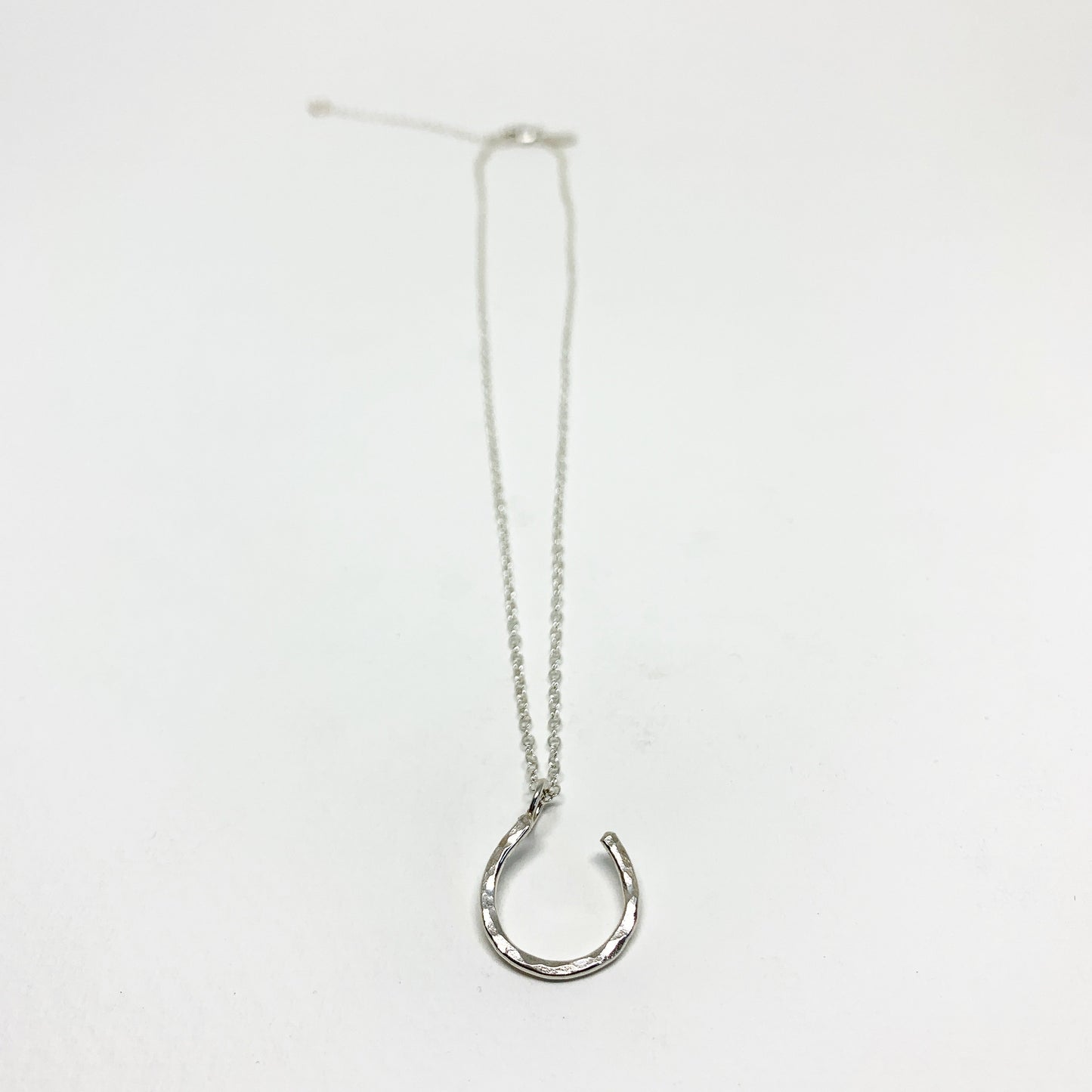 Hanging Lucky Horseshoe Charm Necklace by Jennifer Cervelli Jewelry