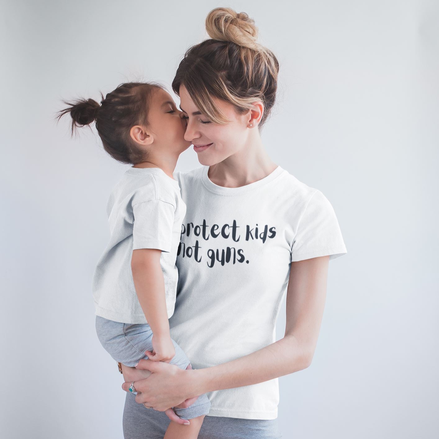 Protect Kids Not Guns | Women’s T-Shirt by The Happy Givers