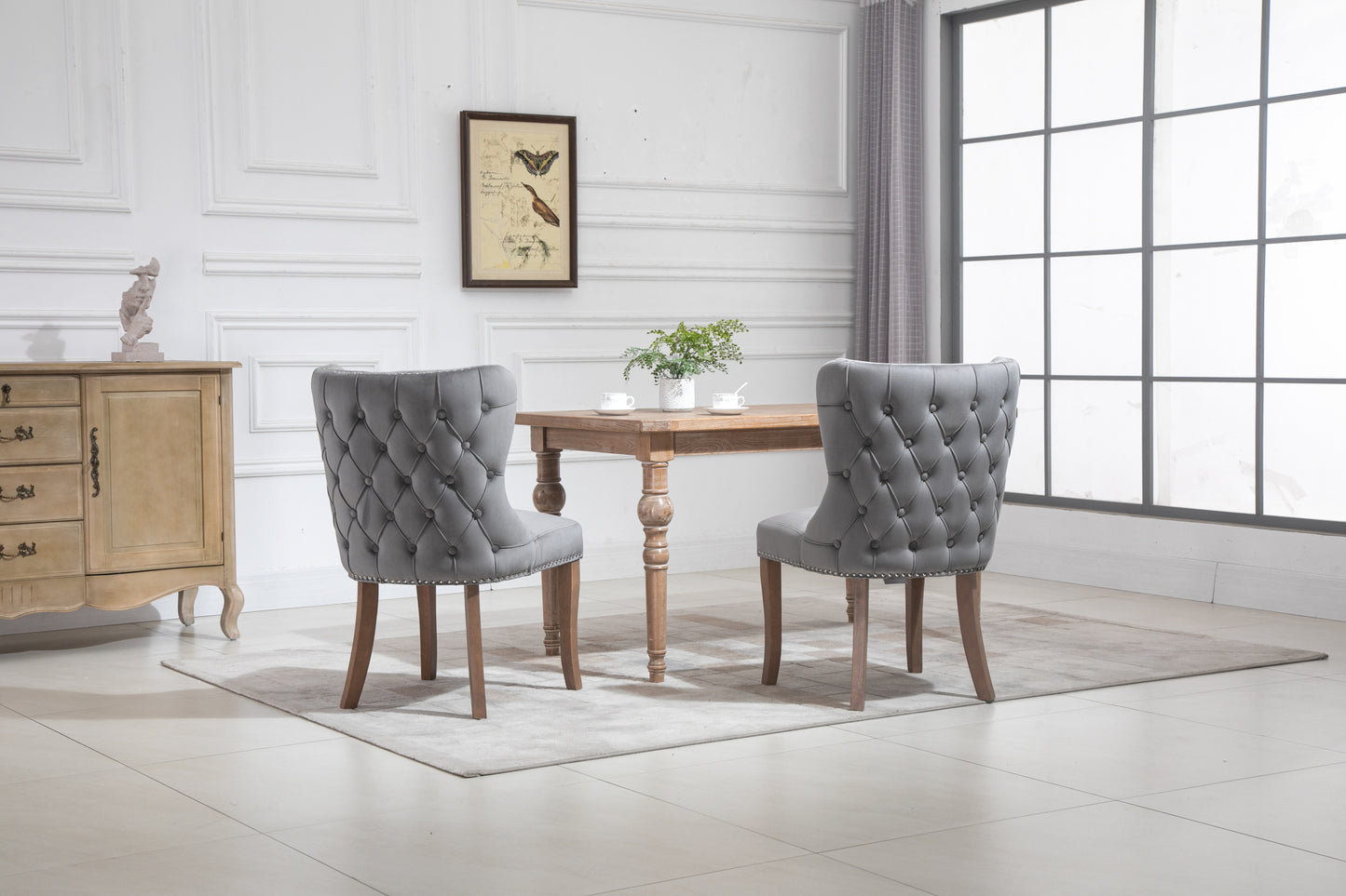 Set of 2 upholstered wing-back dining chair with backstitching nailhead trim and solid wood legs