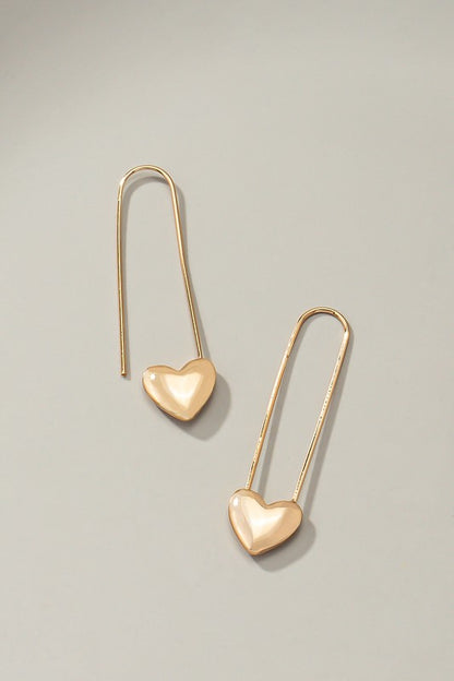Long oval hoop earrings with heart at the bottom