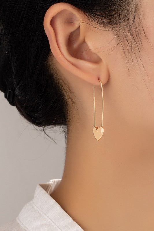 Long oval hoop earrings with heart at the bottom