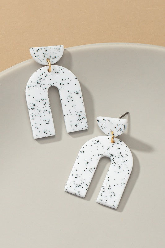 arch drop earrings with black speckles
