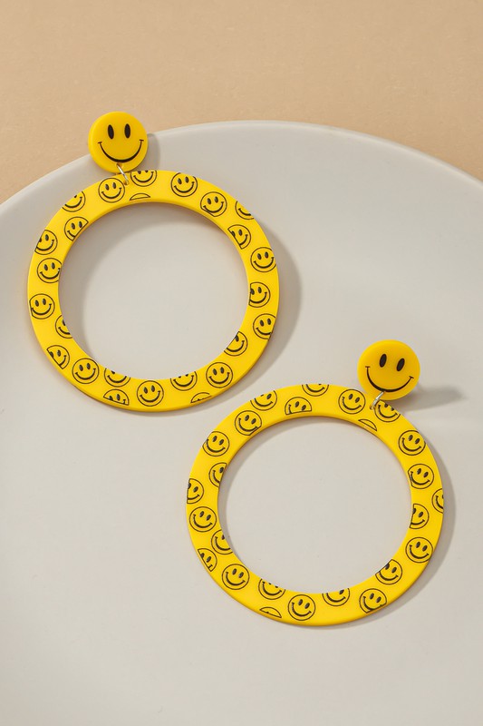 Large smiley face dangling hoop earrings