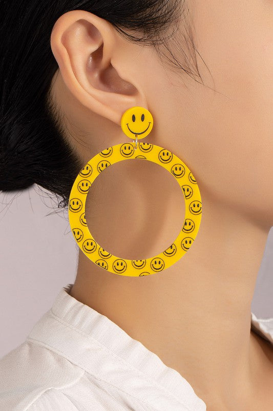 Large smiley face dangling hoop earrings