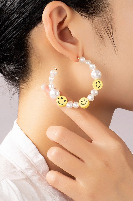 Pearl and smiley face hoop earrings