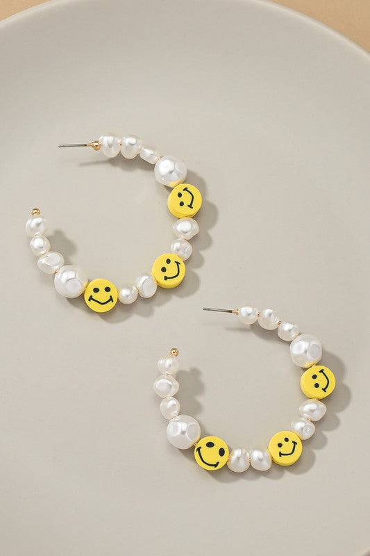 Pearl and smiley face hoop earrings