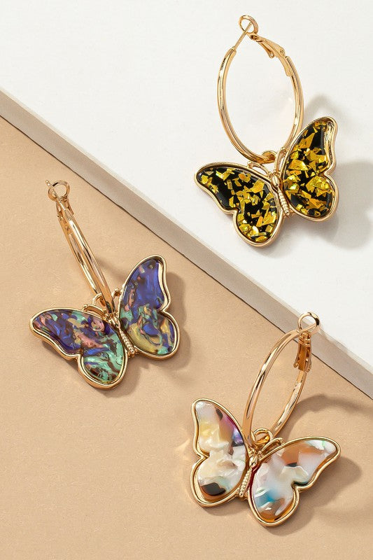 Acetate butterfly dangling on a hoop earrings