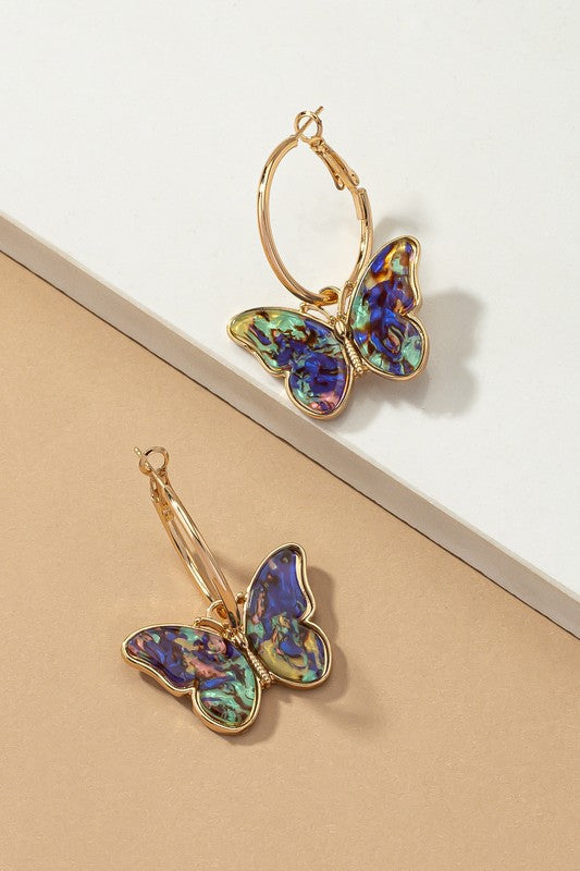 Acetate butterfly dangling on a hoop earrings