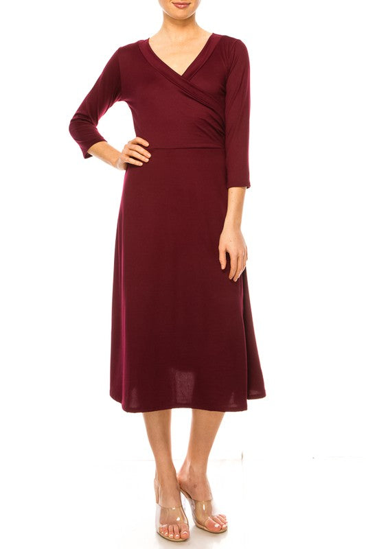 Solid faux wrap dress with deep V-neck