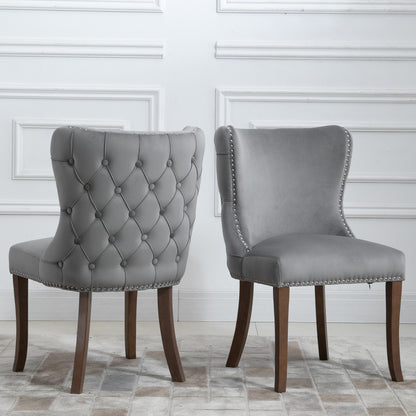 Set of 2 upholstered wing-back dining chair with backstitching nailhead trim and solid wood legs