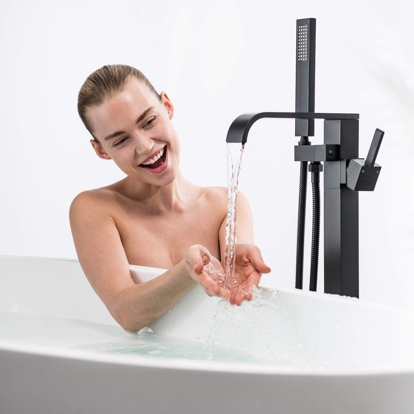 Single-Handle Freestanding Floor Mount Roman Tub Faucet Bathtub Filler with Hand Shower in Matte Black