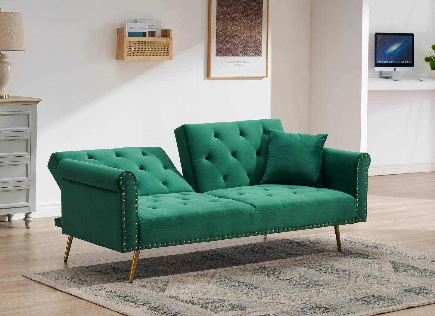 Green velvet nail head sofa bed with throw pillow and midfoot