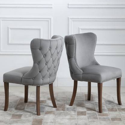 Set of 2 upholstered wing-back dining chair with backstitching nailhead trim and solid wood legs