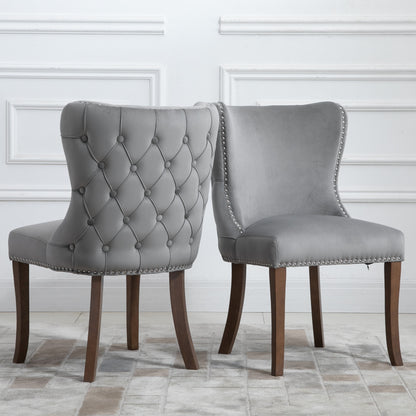 Set of 2 upholstered wing-back dining chair with backstitching nailhead trim and solid wood legs