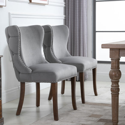 Set of 2 upholstered wing-back dining chair with backstitching nailhead trim and solid wood legs