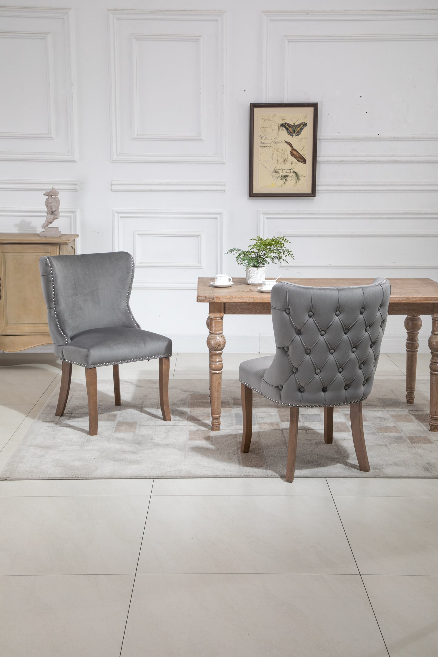 Set of 2 upholstered wing-back dining chair with backstitching nailhead trim and solid wood legs