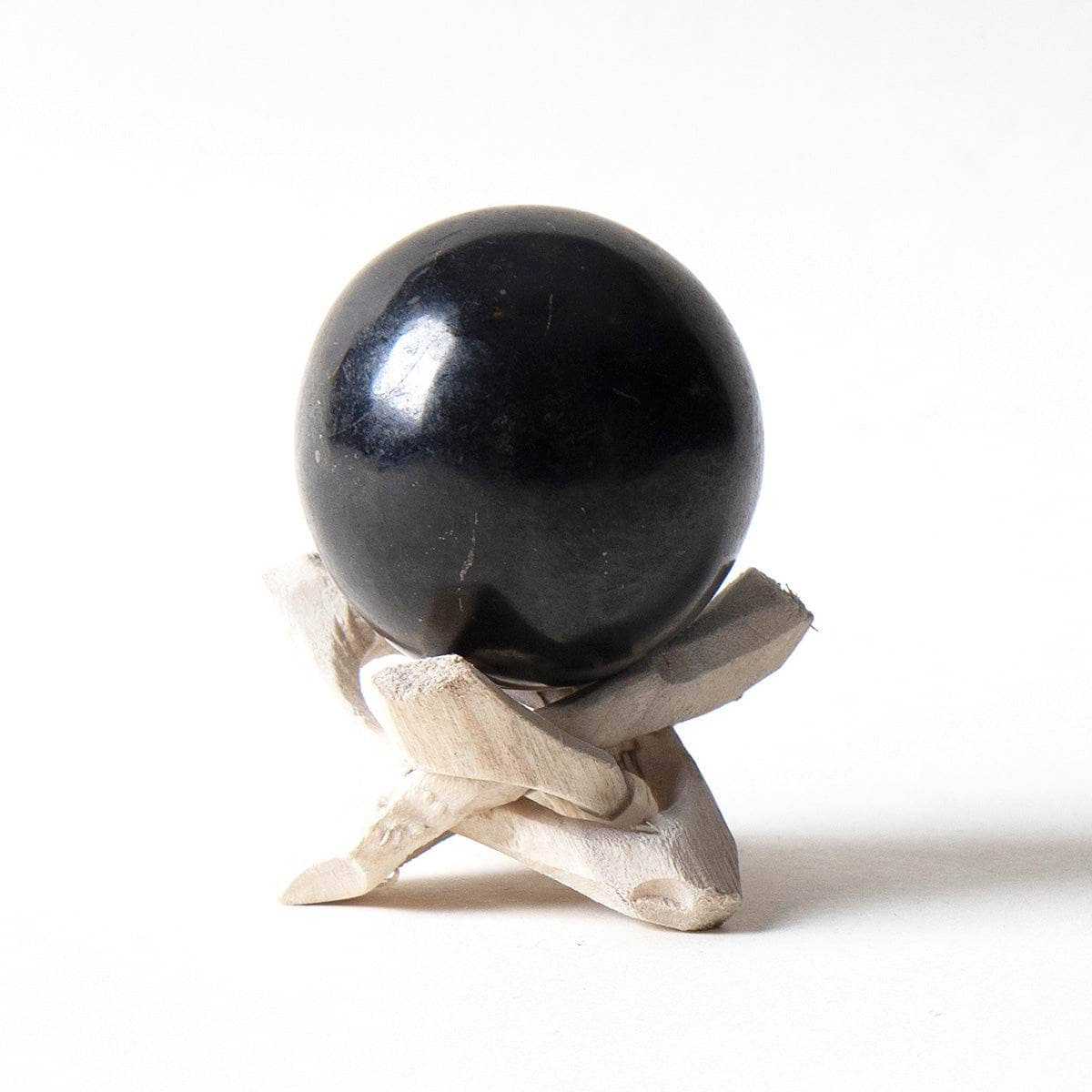 Black Tourmaline Sphere with Tripod by Tiny Rituals