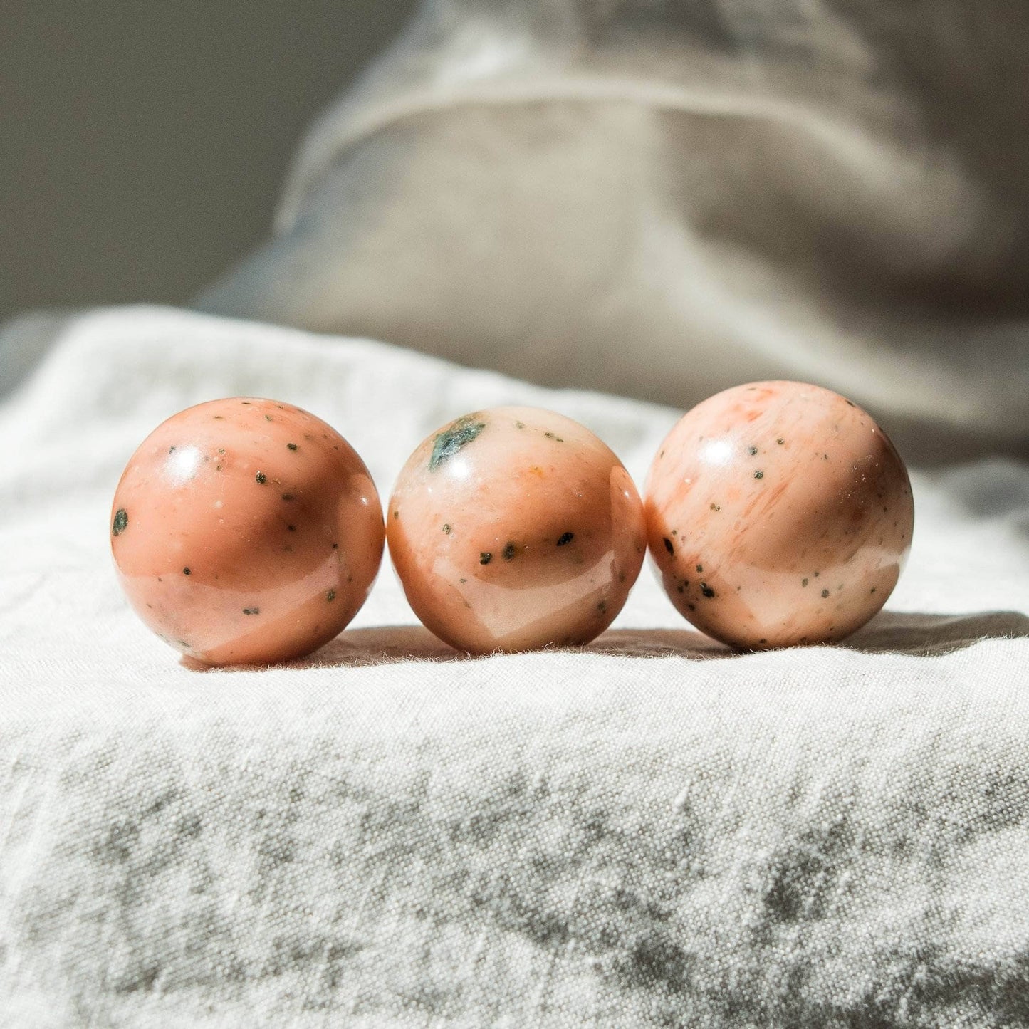 Orange Calcite Sphere with Tripod by Tiny Rituals