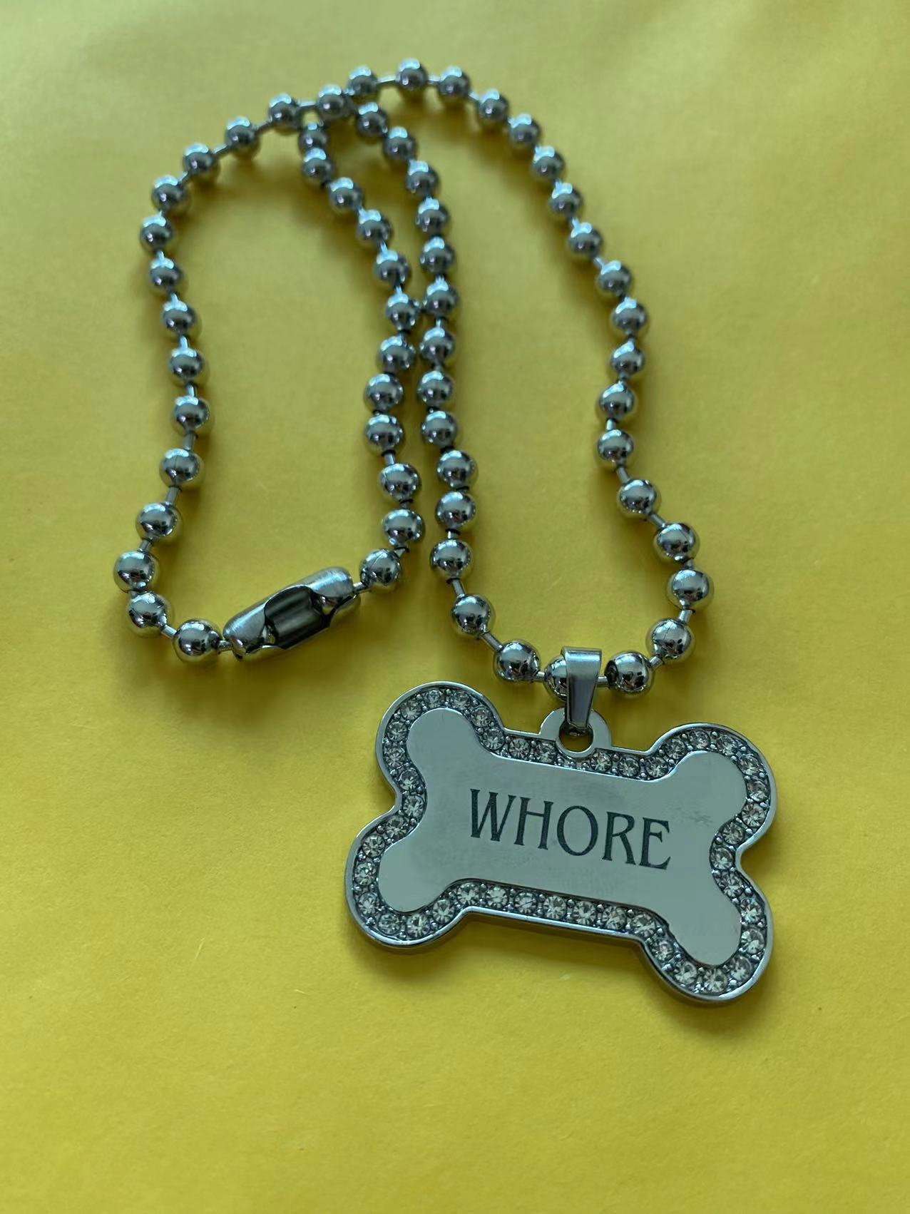 "Whore" Dog Bone Necklace by White Market