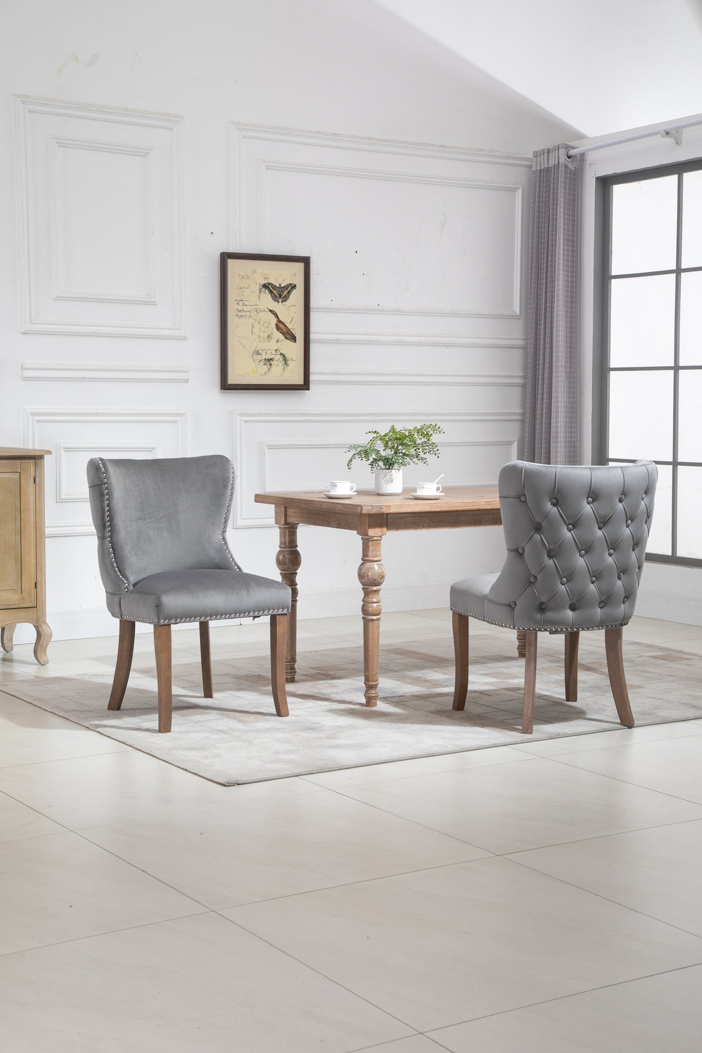 Set of 2 upholstered wing-back dining chair with backstitching nailhead trim and solid wood legs