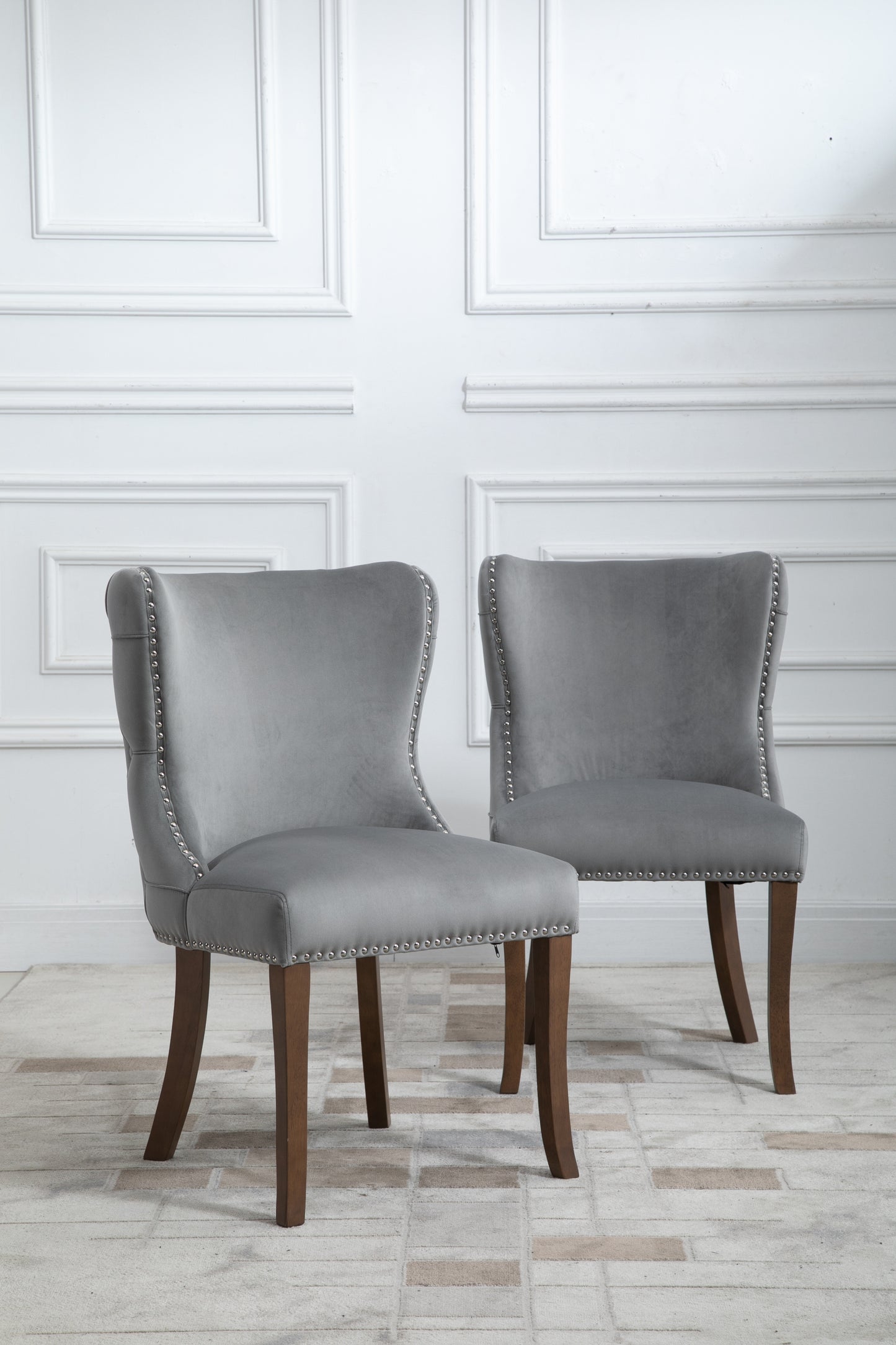 Set of 2 upholstered wing-back dining chair with backstitching nailhead trim and solid wood legs