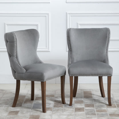 Set of 2 upholstered wing-back dining chair with backstitching nailhead trim and solid wood legs