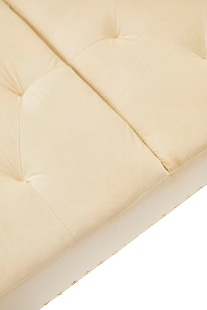 Beige velvet nail head sofa bed with throw pillow and midfoot